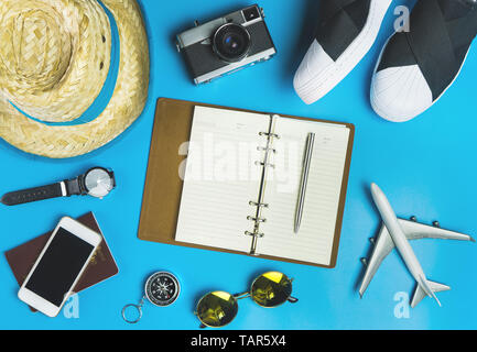 Travel Blogger Accessories and fashion on blue background Stock Photo