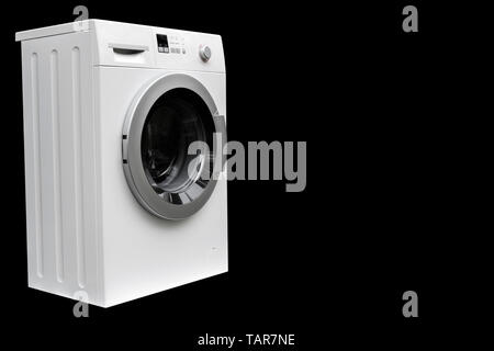 Washing machine isolated on black background. Washing machine isolated over black. Stock Photo