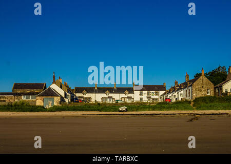 Coastal village of Low Newton-by-the-Sea with pub the Ship Inn in the corner of village square. Northumberland, UK. Summer 2018. Stock Photo