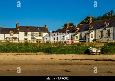 Coastal village of Low Newton-by-the-Sea with pub the Ship Inn in the corner of village square. Northumberland, UK. Summer 2018. Stock Photo