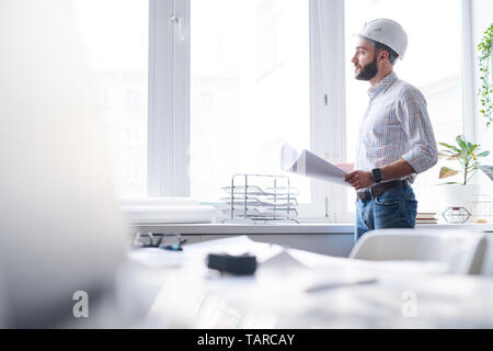 Engineer working in office Stock Photo