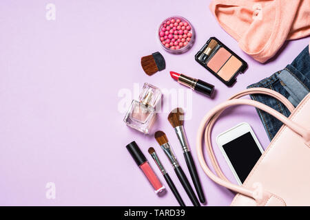 Woman flat lay background with cloth, accerrories and cosmetics.  Stock Photo