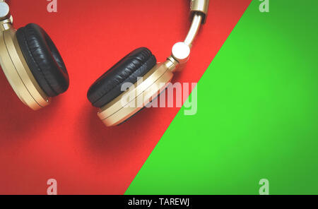 Golden Wireless Audio Hifi headphone on christmas color Stock Photo