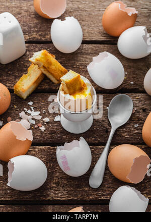 Healthy breakfast with soft boiled egg and empty shells, rustic style Stock Photo