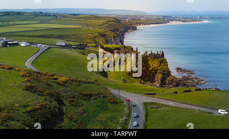 Aerial view over famous Dunluce Castle in North Ireland - travel photography Stock Photo