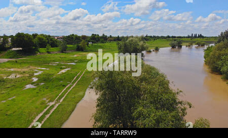 Flooded road to heavy rain flooding taken during a drone flight. Stock Photo