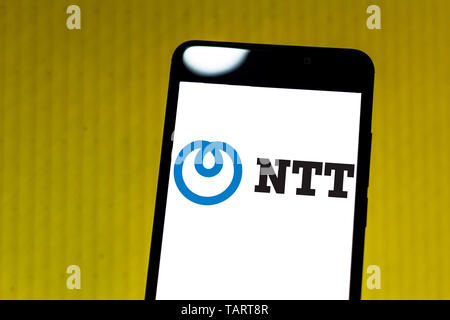 In this photo illustration the Nippon Telegraph and Telephone Corporation (NTT) logo is seen displayed on a smartphone. Stock Photo