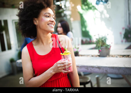 Healthy drinks, diet and people concept. Close up of beautiful afro woman Stock Photo