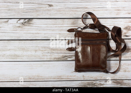 mens leather shoulder bag on wooden background Stock Photo