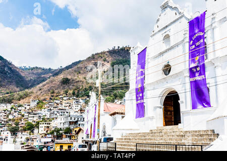 San Antonio Palapo, Lake Atitlan, Guatemala - March 20, 2019: Two churches side by side with Lent colors in lakeside village on Lake Atitlan. Stock Photo