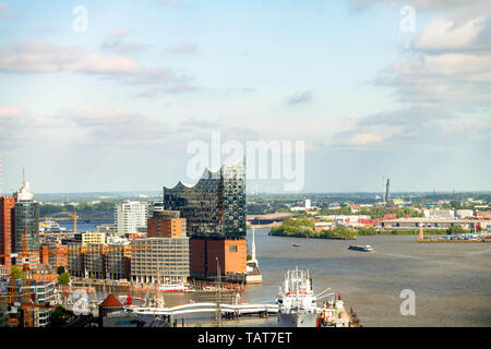 The new modern architecture of the Elbphilharmonie of Hamburg Germany in sunlight with harbor Stock Photo