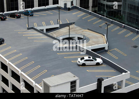 The rooftop of a parking garage with a few cars in downtown (The Loop) Chicago, Illinois, USA Stock Photo