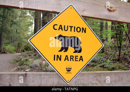 Caution Bear in Area warning sign. Stock Photo
