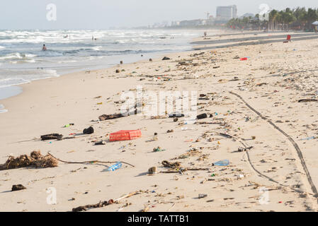 Beach of Da Nang City, Vietnam, after a storm, covered with garbage. Stock Photo