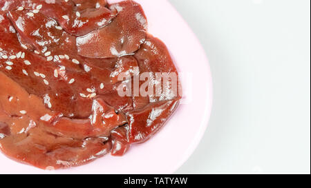 top view raw pork liver on plate  isolated on white background Stock Photo