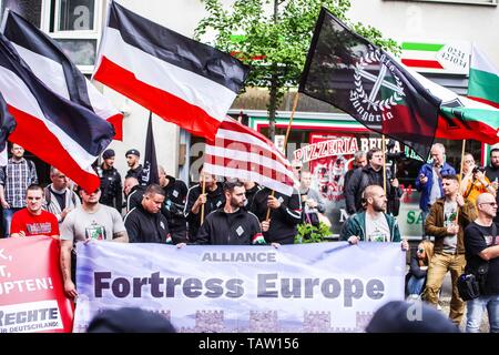 Dortmund, Nordrhein Westfalen, Germany. 25th May, 2019. The Alliance Fortress Europe consisting of German, French, Bulgarian, and Hungarian neonazis as seen in Dortmund, Germany. Prior to the European Elections, the neonazi party Die Rechte (The Right) organized a rally in the German city of Dortmund to promote their candidate, the incarcerated Holocaust denier Ursula Haverbeck. The demonstration and march were organized by prominent local political figure and neonazi activist Michael Brueck (Michael BrÃ¼ck) who enlisted the help of not only German neonazis, but also assistance from Russian, Stock Photo