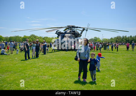 East Meadow, New York, USA. 25th May, 2019. U.S. Navy MH53-E helicopter has crowds looking at it inside and outside, at the U.S. Navy hosted aviation event, as part of Fleet Week, on Memorial Day Weekend at Eisenhower Park on Long Island. Visitors could speak with members of Command HM14, Helicopter Mine countermeasures Squadron 14, which has a Korea deployment mine sweeping. MH-53E does long range minesweeping, AKA Airborne Mine Countermeasures (AMCM) missions, and carries heavy loads and transports and picks up things for the Navy. Credit: Ann Parry/ZUMA Wire/Alamy Live News Stock Photo