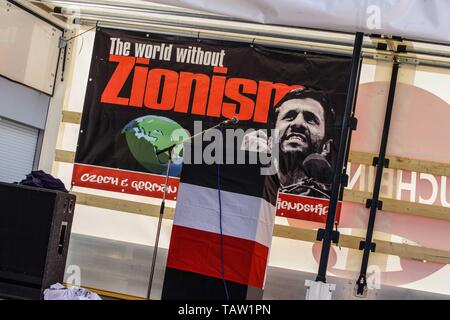 Dortmund, Nordrhein Westfalen, Germany. 25th May, 2019. A banner that was later forbidden by police at a neonazi rally in Dortmund. The banner has the face of former Iran President Ahmadenijad, who the group states is an ally of national socialists. Prior to the European Elections, the neonazi party Die Rechte (The Right) organized a rally in the German city of Dortmund to promote their candidate, the incarcerated Holocaust denier Ursula Haverbeck. The demonstration and march were organized by prominent local political figure and neonazi activist Michael Brueck (Michael BrÃ¼ck) who enlisted Stock Photo