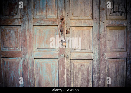 old wooden doors ancient with padlock on door Stock Photo