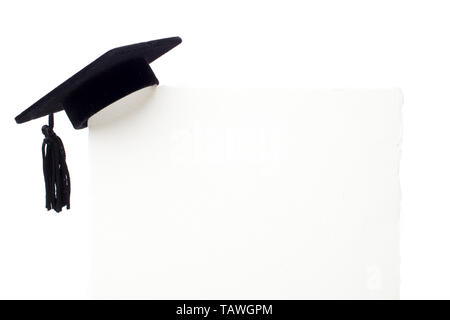 Black Graduation cap on blank white billboard Stock Photo