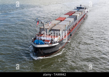 Rotterdam, Netherlands - May 9, 2019 : A small container ship on the new Meuse river aerial view Stock Photo