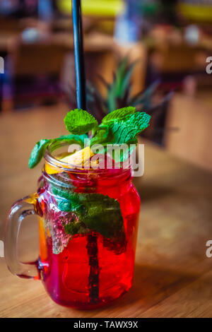 Raspberry Mocktail With Fresh Raspberries  and Mint and Lemon Garnish Stock Photo