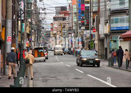 KYOTO, JAPAN - APRIL 14, 2012: People visit Gion district in Kyoto, Japan. 13,413,600 foreign tourists visited Japan in 2014. Stock Photo