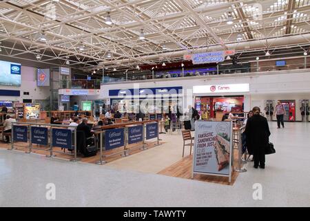 BIRMINGHAM, UK - APRIL 24, 2013: Travelers wait at Birmingham International Airport, UK. With 8.9 million travelers served it was the 7th busiest UK a Stock Photo