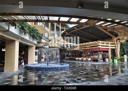 MANILA, PHILIPPINES - DECEMBER 7, 2017: People visit Greenbelt shopping center in Makati City, Metro Manila. The mall is owned by Ayala Corporation, l Stock Photo