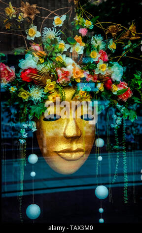 05 14 2019 Russia, Bryansk. Beautifully decorated gold mask in a shop window. Stock Photo