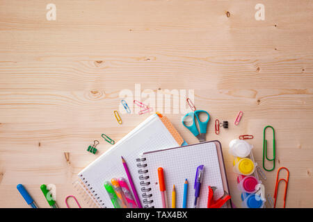 Arrangement of various school supplies on wooden background, copy space, flat lay Stock Photo