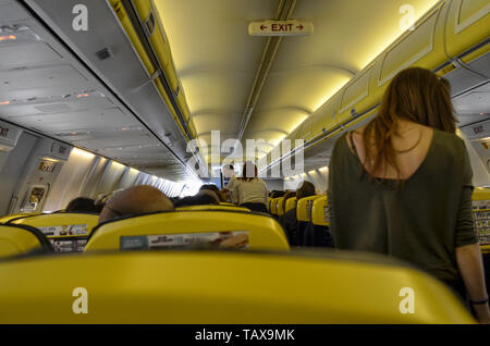 Caselle Airport, province of Turin, Piedmont region, Italy. June 14 2018. Internal view of the Ryanair flight to London Stansted airport. Passengers a Stock Photo