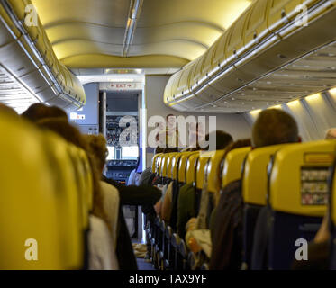 Caselle Airport, province of Turin, Piedmont region, Italy. June 14 2018. Internal view of the Ryanair flight to London Stansted airport. Passengers a Stock Photo