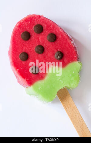 Rowntrees Strawberry ice lolly isolated on white background - strawberry and kiwi water ice with chocolate flavoured pieces Stock Photo