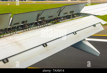 view of the spoiler uprising during a landing of an airliner at Brussels National Airport Stock Photo