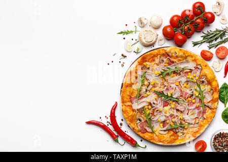 Pizza With Ham And Rocket Salad On White Background With Ingredients Around Stock Photo