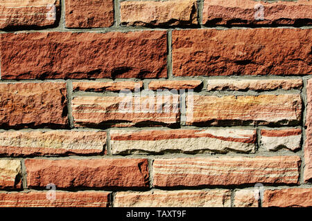 Texture background of a red sandstone wall. Stock Photo