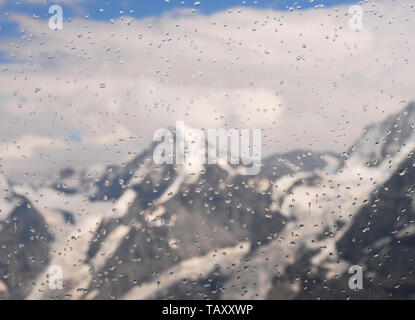 raindrops on window glass and mountains in the background, Jungfrau region, Switzerland Stock Photo
