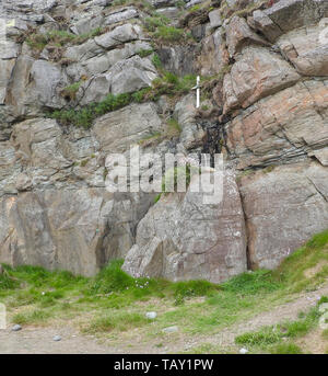 Makeshift crosses and ones carved into rock near Saint Ninian's Cave, a place of pilgrimage for Christians near Whithorn,Wigtownshire,Scotland photographed 2019) Stock Photo