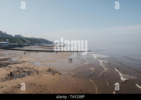 Cromer, UK - April 20, 2019: High angle view of the Cromer beach, people in the distance. Cromer is a seaside town in Norfolk and a popular family hol Stock Photo