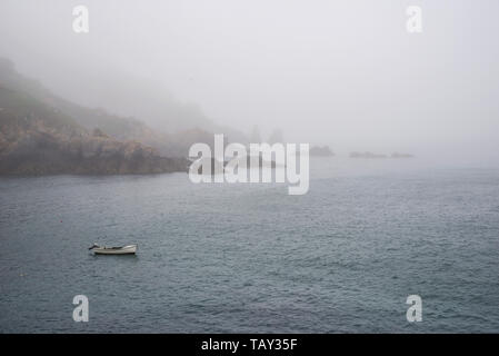 Sea fret rolling in over Saints Bay harbour - Guernsey, Channel Islands (UK) Stock Photo