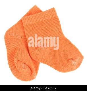 Orange baby socks isolated on white background Stock Photo