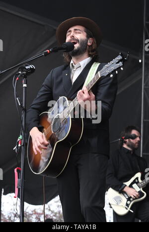 Singer, songwriter and guitarist Ben Schneider is shown performing on stage during a 'live' stand up concert appearance with Lord Huron. Stock Photo