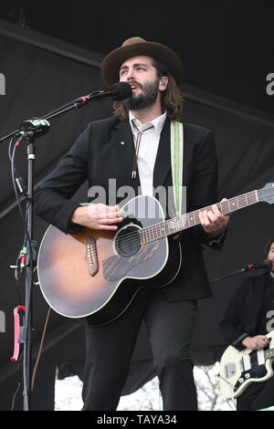 Singer, songwriter and guitarist Ben Schneider is shown performing on stage during a 'live' stand up concert appearance with Lord Huron. Stock Photo