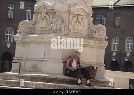 Elder man relaxing on the streets of Szeged, Hungary Stock Photo