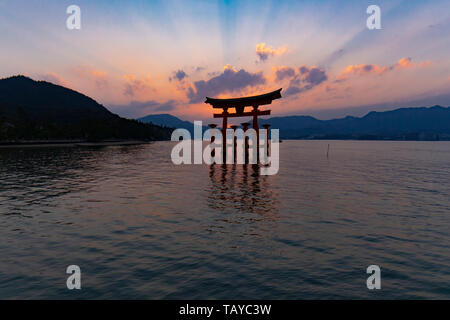 The Great Torii of Itsukushima Shrine at sunset - Miyajima, Japan Stock Photo