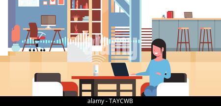 woman sitting at workplace with laptop using intelligent smart speaker with voice recognition artificial intelligence assistance concept modern Stock Vector