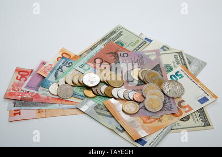 A composition with various country banknotes and coins Stock Photo - Alamy