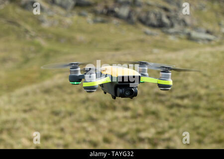 Close Up of a Drone Flying in a Mountain Environment Stock Photo