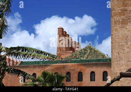 view over walls of andalusian garden in Rabat, Morocco to roof with green tiles Stock Photo